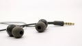 Close up of black wired earphones Royalty Free Stock Photo