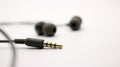 Close up of black wired earphones Royalty Free Stock Photo