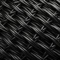 Close-up of a black woven material showcasing a textured pattern formed by Royalty Free Stock Photo