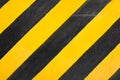 Close-up of black and yellow crosswalk texture, background