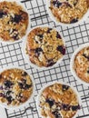 Close up blackcurrant muffins with oatmeal crumble on a baking rack on a light background, top view Royalty Free Stock Photo