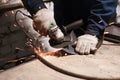 Close up of blacksmith grindering a metal plate Royalty Free Stock Photo
