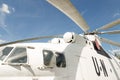 Close-up blade rotors and engine of big cargo-passenger U.N. helicopter against blue sky on background Royalty Free Stock Photo