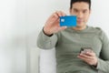 Close up of blank blue smart card in man hand. man holding blue smart card.