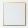 Close up of a blank canvas with a thin golden metallic frame view isolated on white background Royalty Free Stock Photo