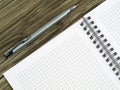 Close up of blank notebook and a pen on wooden office desk with copy space Royalty Free Stock Photo