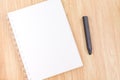 Close up blank open ring binder notebook with black pencil on wood table,Business template mock up for adding your text Royalty Free Stock Photo