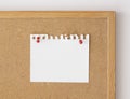 Close up blank paper sheet mockup pinned over board. Cork board background, front view Royalty Free Stock Photo