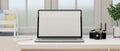 Close-up, Blank screen laptop computer on a modern white office desk Royalty Free Stock Photo