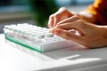 Close-up of a blind man\'s hands reading braille on the packaging of medicines, pills. World Braille Day concept