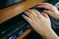 Close-up blind person hands using computer with braille display or braille terminal a technology assistive device for persons with Royalty Free Stock Photo