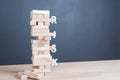 Close up blocks wood game with word risk on tower wood block wo Royalty Free Stock Photo