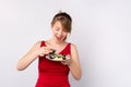 Close up of blonde woman holding bowl with soy sauce and plate with vegetarian sushi roll on white background, japanese Royalty Free Stock Photo