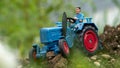 Close up of blue agricultural tractor toy