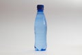 Close-up of blue bottle of water against white background Royalty Free Stock Photo