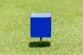 Close-up blue color wooden tee off area or tee box with blurred Royalty Free Stock Photo