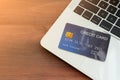 Close-up of the blue credit card on laptop keyboard. Concept of internet purchase Royalty Free Stock Photo