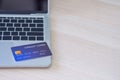 Close-up of blue credit card is placed on the laptop Royalty Free Stock Photo