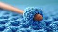 Close Up of Blue Crochet With Wooden Handle