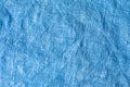 Close up blue crumpled linen background. Non-sticky fibers of hand-woven fabric close-up