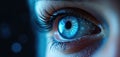 Close-up of a blue cybernetic eye with circuit board patterns. AI technology scans for threats, representing digital security and Royalty Free Stock Photo