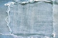 Blue denim frame light texture with torn patterns abstract for background and space Royalty Free Stock Photo