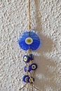 Blue evil eye beads on the wall Royalty Free Stock Photo