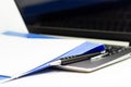 Close Up Blue file folder and Laptop Computer on desk in meeting room Royalty Free Stock Photo