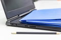 Close Up Blue file folder and Laptop Computer on desk in meeting room, business concept Royalty Free Stock Photo