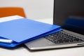 Close Up Blue file folder and Laptop Computer on desk in meeting room, business Royalty Free Stock Photo