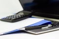 Close Up Blue file folder and Laptop Computer on desk in meeting room Royalty Free Stock Photo