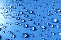 Close up Blue glass surface with clear water drops, background Royalty Free Stock Photo