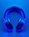 Close up of Blue Glowing Headphones Against a Dark Blue Background Royalty Free Stock Photo