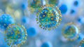 A close up of blue and gold coronaviruses