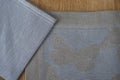 Close-up of Blue and Gray Placemat and Table Napkin Corners