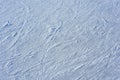 Close up blue ice rink texture with scratches. Ice surface with skating tracks.. Frozen background.Texture. Abstraction. Royalty Free Stock Photo