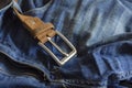 Close-up of blue jeans with a brown leather belt Royalty Free Stock Photo