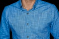 Close-up blue linen shirt men's business style clothing on black background Royalty Free Stock Photo