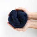 Close-up of blue merino wool ball in hands Royalty Free Stock Photo