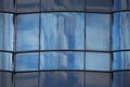 Close up of blue modern architecture glass wall facade with reflection, background Royalty Free Stock Photo