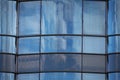 Close up of blue modern architecture glass wall facade with reflection, background Royalty Free Stock Photo