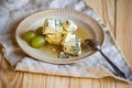 Blue mold cheese and grapes on a plate