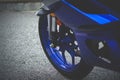 Close up blue motorcycle front tire. Royalty Free Stock Photo
