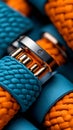 A close up of a blue and orange bracelet on a table Royalty Free Stock Photo