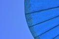 Close-up of a blue parasol umbrella against the blue sky Royalty Free Stock Photo