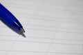 Close up of blue pen on lined paper Royalty Free Stock Photo