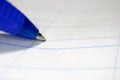 Close up of blue pen on lined paper Royalty Free Stock Photo