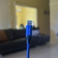 Close up of a Blue phone cable charger with shallow depth of field Royalty Free Stock Photo