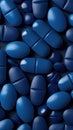 Close Up of Blue Pills on Black Background Royalty Free Stock Photo