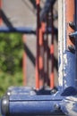 Close-up of a blue and red climbing frame or jungle gym in kids\' playground on a sunny summer day in sunlight. Royalty Free Stock Photo